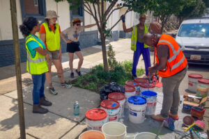 Sweet 27 Parklet Pavement Mural install team mixing demonstration