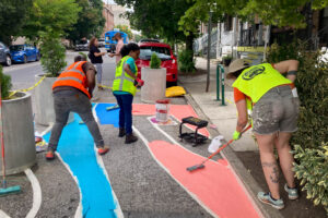 Sweet 27 Parklet Pavement Mural install team brooming