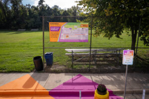 We Love Towanda drop off zone mural loading zone sign, planters, and wayfinding banner