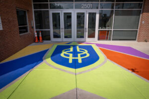 FES Rooted in Our Values main entrance school shield