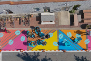 Hyattsville Bean There Sun That Gallatin Vigilante Coffee parklet people gathered aerial detail view