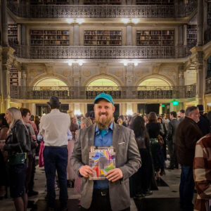 BmoreArt Collaboration Graham Projects Graham holding magazine in Peabody Library