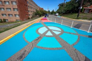 Rays of Peace perspective at Nicholson & 30th with large peace sign in the middle