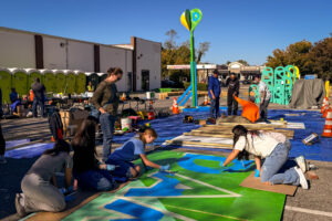 Damascus Placemaking Festival volunteers painting mural