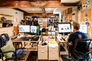 Graham Coreil-Allen working at his desks in the Graham Projects studio
