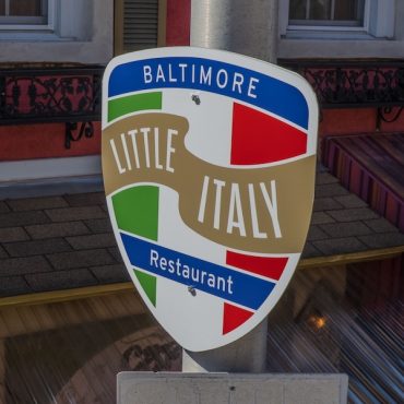 Photo featuring signage designed for wayfinding in Little Italy