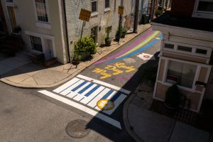 Lady Day Way Rhythm of Billie birds-eye view of piano keys crosswalk and text art at Pratt Street