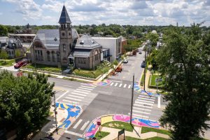 3rd & Patapsco Celestial Crossings birds-eye wide view of intersection with wayfinding trail of stars leading towards school